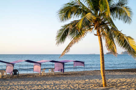 Rodadero Beach at sunset with empty chairsの写真素材