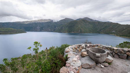 Lake landscape and offering site with ancient Inca vessel at the Cuicocha Lagoon, Ecuador - February, 18th , 2019のeditorial素材