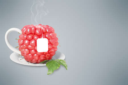 Raspberry tea cup. Healthy food. Raspberry drinkの写真素材