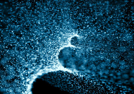 Blue bokeh texture on black background