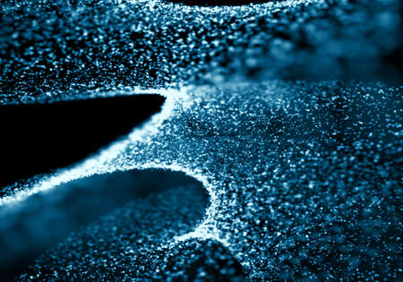 Blue bokeh texture on black background