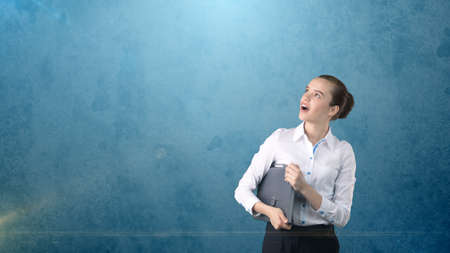 Beautiful woman with hair ban in white skirt close up portrait with grey briefcase,isolated...
