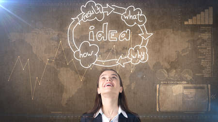 Creative ideas concept, beautiful businesswoman standing on studio painted background near idea organizational chart.の写真素材