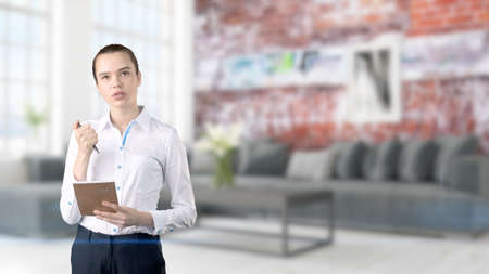 Young Business woman over interior backgroundの写真素材