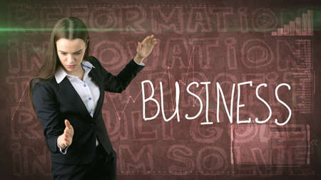 Beauty businesswoman on painted background with marketing words. Advertising, investment and business plan conceptの写真素材