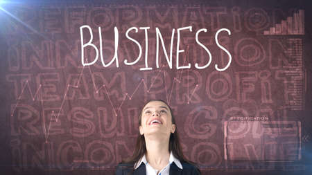 Beauty businesswoman on painted background with marketing words. Advertising, investment and business plan conceptの写真素材