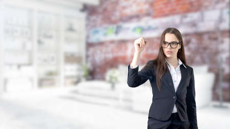 Young Business woman over interior backgroundの写真素材