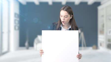 Young Business woman over interior backgroundの写真素材