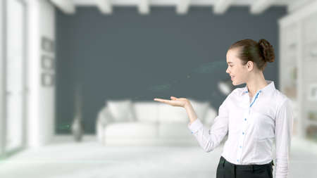 Young Business woman over interior backgroundの写真素材