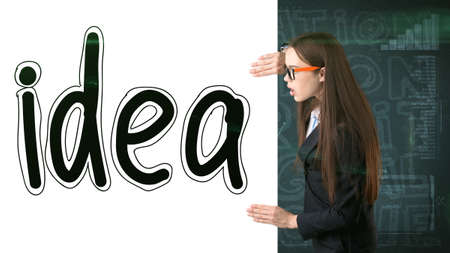 Beauty businesswoman on painted background with marketing words. Advertising, investment and business plan conceptの写真素材