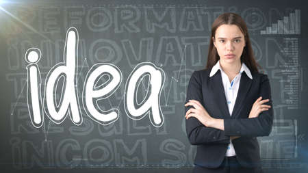 Beauty businesswoman on painted background with marketing words. Advertising, investment and business plan conceptの写真素材