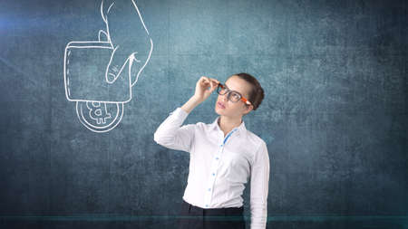 Lucky cute lady and bitcoin investment. Concept of mining and virtual criptocurrency. Successful money making.の写真素材