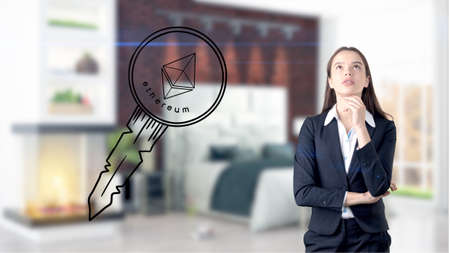 Ethereum sketch with young businesswoman in a suit with longhair and pretty thoughtful face. Criptocurrency concept.の写真素材