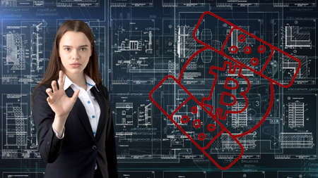 Bauty business woman standing in suit with Bitcoin Logo to illustrate the use of bitcoin for trading or money transfer.の写真素材