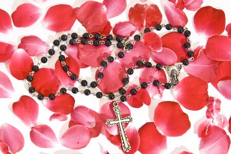 Rosary on rose leafsの写真素材