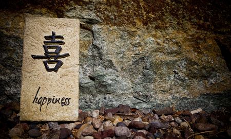 Rock slab with etched with the word happinessの写真素材