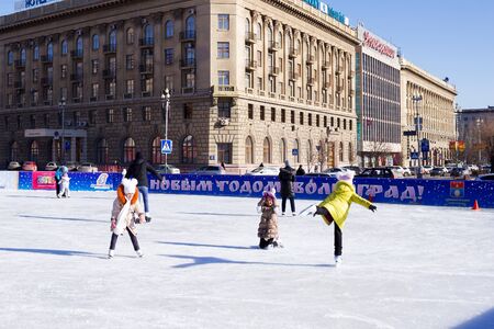 VOLGOGRAD, RUSSIA - February 13, 2015: Children skate on the ice rink. Volgograd, Russiaのeditorial素材