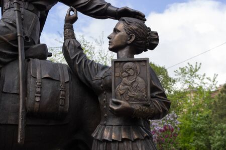 VOLGOGRAD, RUSSIA - May 3, 2016: A monument the Cossack glory - the girl with an icon sees off the guy on a horse at way. It is established on the central embankment. Volgograd, Russiaのeditorial素材