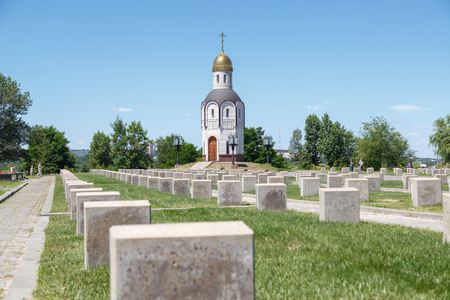 VOLGOGRAD, RUSSIA - July 06, 2016: A Christian Chapel and gravestones at the Volgograd soldier's memorial cemetery. Mamayev Kurgan, Volgograd, Russiaのeditorial素材