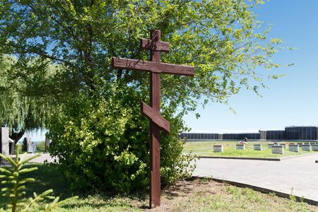 VOLGOGRAD, RUSSIA - July 6, 2016: A wooden cross at the military, soldier's cemetery the dead during World War II (Great Patriotic War) of war in days of the battle of Stalingrad, Mamayev Kurganのeditorial素材