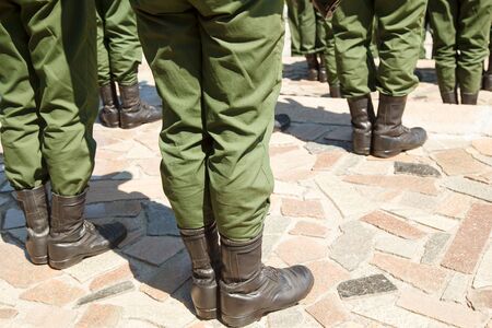 The soldier's footwear of the Russian army which is put on legs in clear sunny dayの写真素材