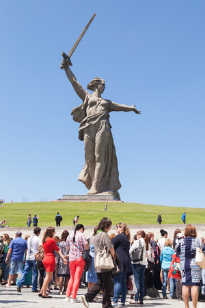 VOLGOGRAD, RUSSIA - May 28, 2017: Tourists, there are a lot of people against the background of a monument to the Great Patriotic War, World War II, the Motherland calls!, in the territory Mamayev Kurgan, Volgograd, in the summer in the afternoonのeditorial素材