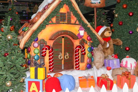 VOLGOGRAD, RUSSIA - December 07, 2017: The festive New Year's toy lodge near gifts, toys and a fir-tree decorates the foyer "Shopping center" in Voroshilovsky district of the city of Volgogradのeditorial素材