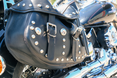 VOLGOGRAD, RUSSIA - May 5,2018: The black leather bag is attached to a motorcycle seatのeditorial素材