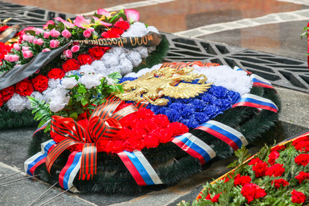 VOLGOGRAD, RUSSIA - May 9, 2018: A wreath from flowers on a grave to the soldiers who have died ÑÐ¾Ð²ÐµÑÑÐºÐ¼ on a gray granite stoneのeditorial素材