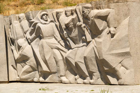 KERCH, RUSSIA - June 30, 2019: Bas-relief of WAR soldiers at the Sail monument in Kerchのeditorial素材