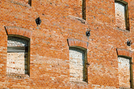 VOLGOGRAD, RUSSIA - 27 April, 2019: windows of the destroyed house from a brick, Gergardt's Mill or Grudinin's mill, in Volgogradのeditorial素材