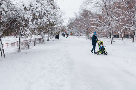 VOLGOGRAD, RUSSIA - 23 December, 2018: Walks of people in the winter park in the winter with white snow and hoarfrost on treesのeditorial素材