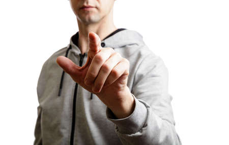 sports man shows his index finger at. Isolated, on whiteの写真素材