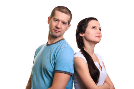 Portrait of adult couple, man looking into camera, woman thinking smiling looking up