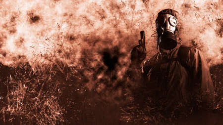 grown male stalker holds a gun pistol in his hand. He is dressed in a protective jacket with a hood,...