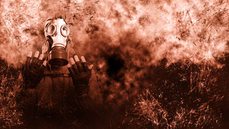 A shot of a man dressed in a gas mask, a hooded jacket, a backpack, praying, with his hands tinged...