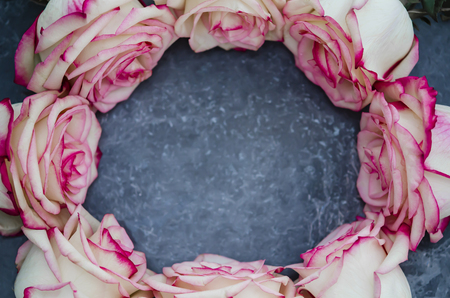Roses on dark marble background with place for text. Flat lay.の写真素材