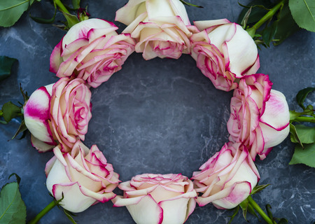 Roses on dark marble background with place for text. Flat lay.の写真素材