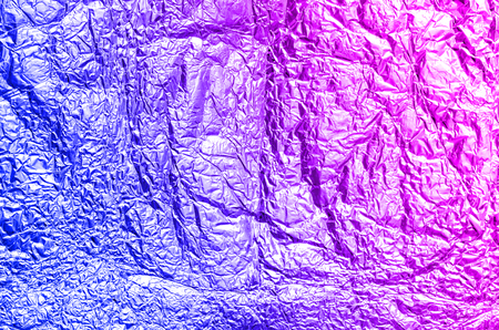 Purple and blue foil abstract background in trending neon colors.の写真素材
