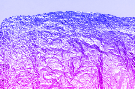 Purple and blue foil abstract background in trending neon colors.の写真素材