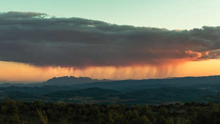 Forest landscape with the mountain of Montserrat in the backgroundの写真素材