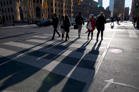 pedestrian crossing the road at the downtown districtのeditorial素材