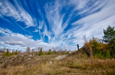 Healthy lifestyle - hiking  in the public park with dramatic cloudscape.の写真素材