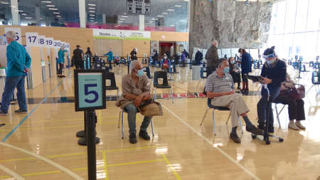 Toronto, Ontario, Canada - 03/29/2021: People sitting for 15 minutes in the observation area after...