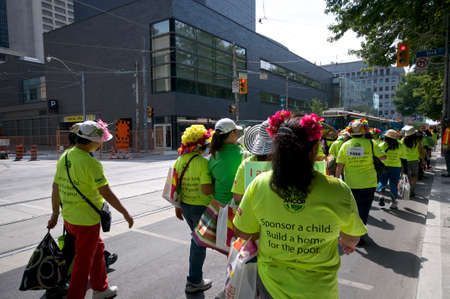 Toronto, Ontario, Canada - 08/25/2013: Protestors holding banners and placard against the Canadian government on the issue on sponsor child in Philipineのeditorial素材