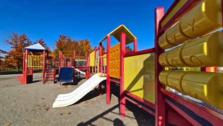 Playground with slide at the public park in autumnの写真素材