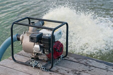 water pump updated water from a lakeの写真素材