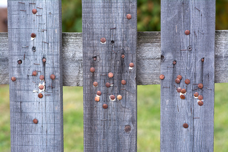Rustic wooden fence used as a notice board. Abstract photographyの写真素材