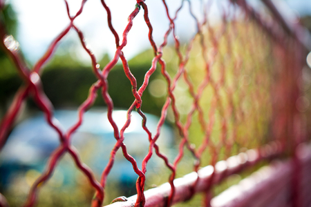 Abstract red fence with blurred backgroundの写真素材