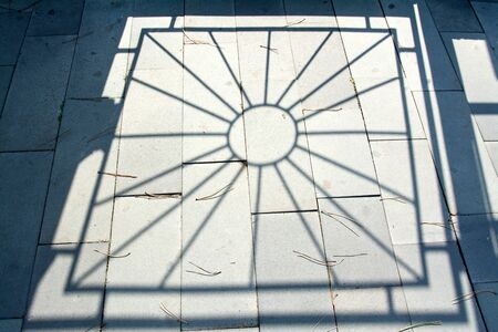 Sun, shadow of fence. Abstract photo illustrationの写真素材